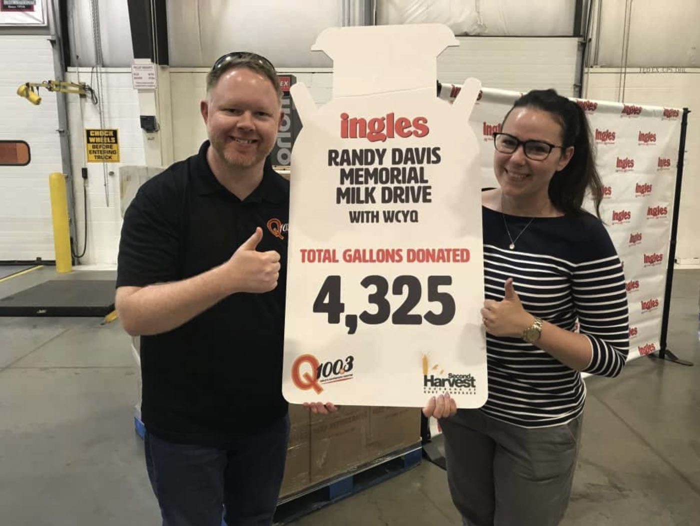 A Randy Davis Memorial Milk Drive sign showing 4,325 gallons donated