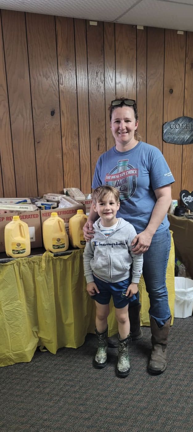 A mother and son at a pantry table with milk